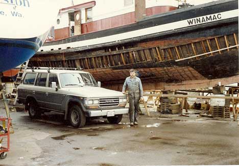 Here is a photo of me with my tugboat and brand new Toyota Land Cruiser: